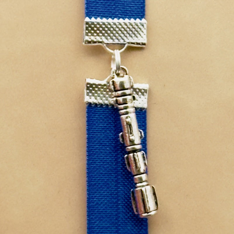 A silver Star Wars Lightsaber charm on a elastic Bookband